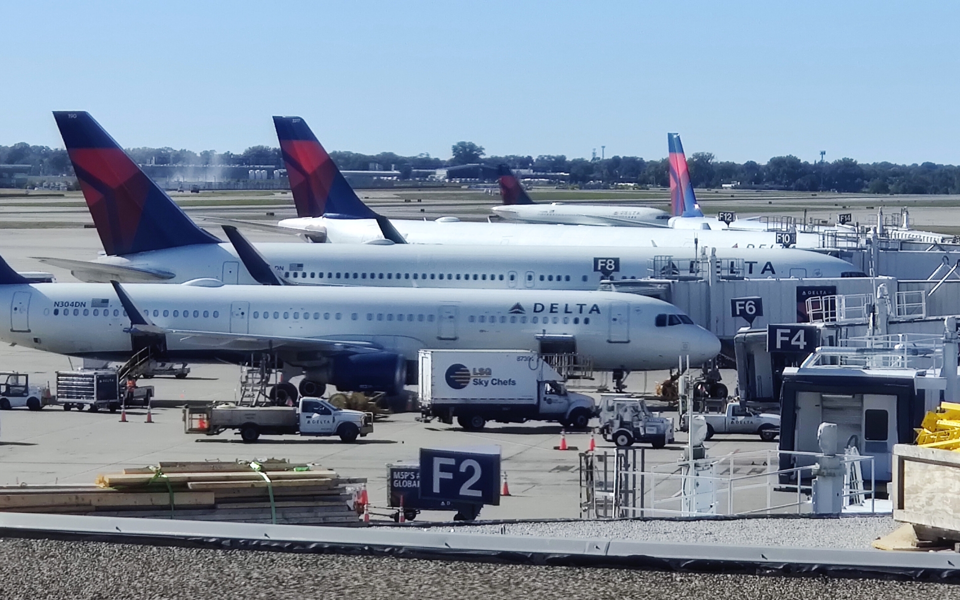 Delta planes lined up at various gates at MSP Airport.