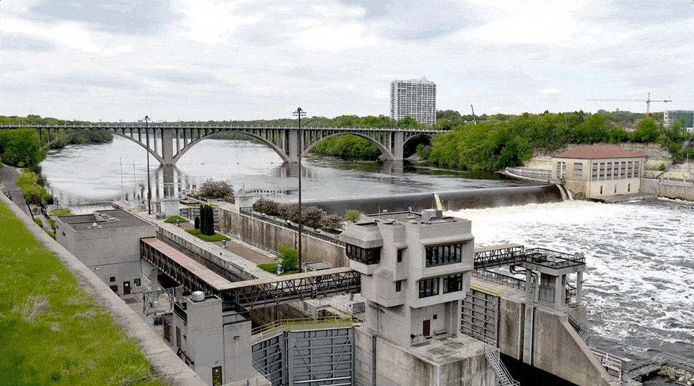 An animated GIF showing a photo of Lock and Dam 1, which fades to an illustration showing the area if the lock and dam were to be removed.