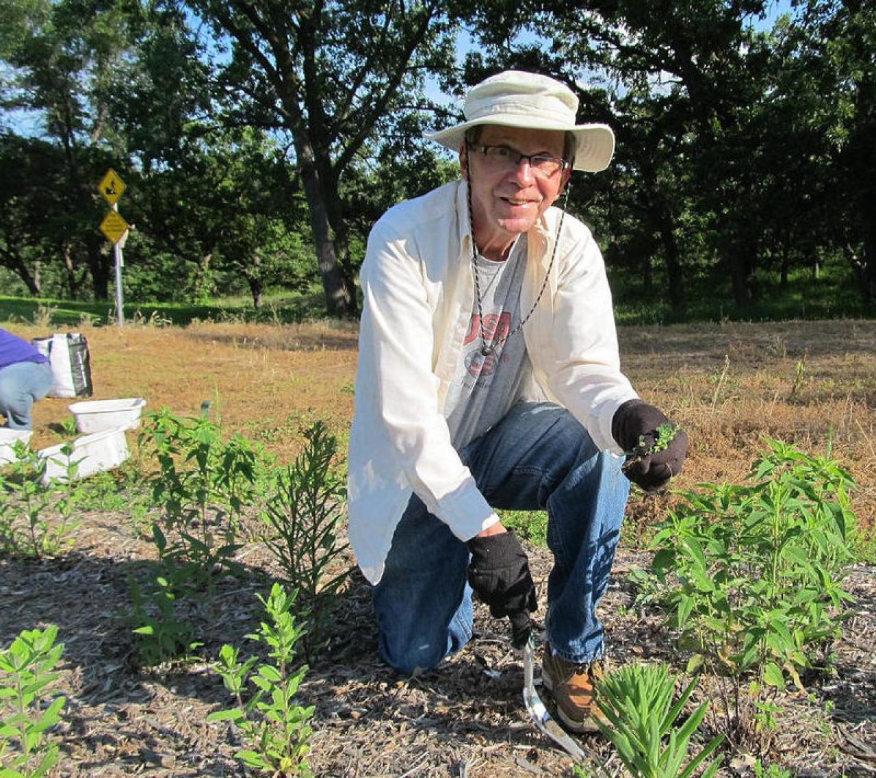 Volunteer tending Old Mill Park