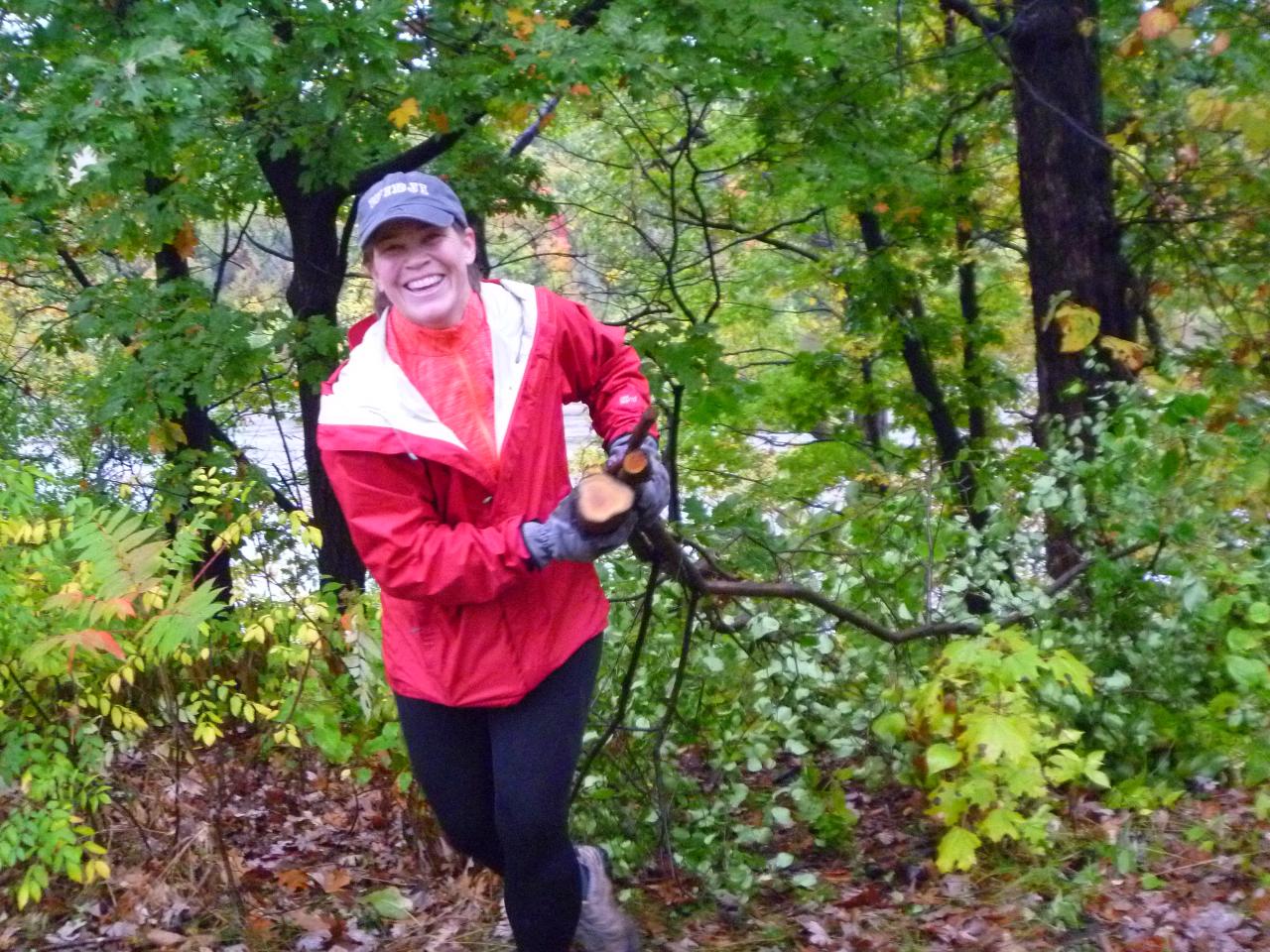 A volunteer hauls buckthorn in the river gorge