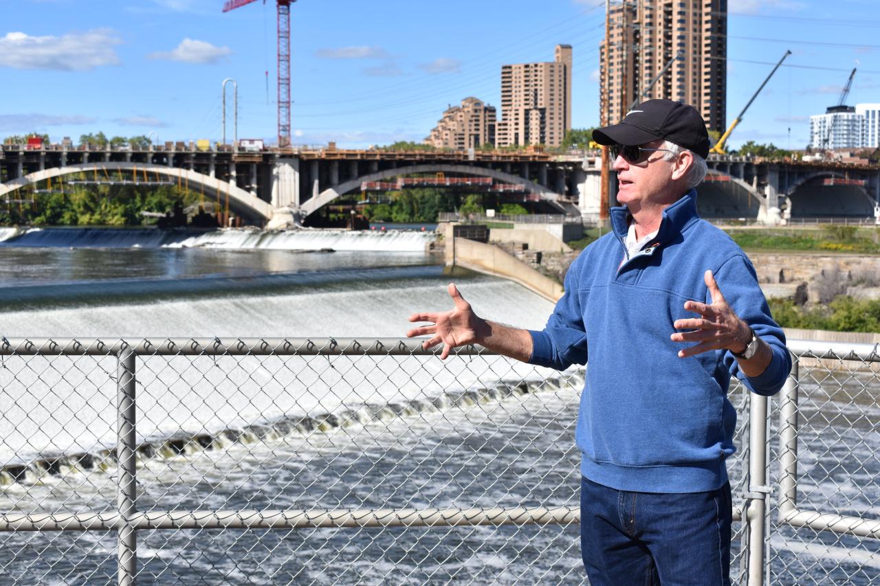 John in front of St. Anthony Falls