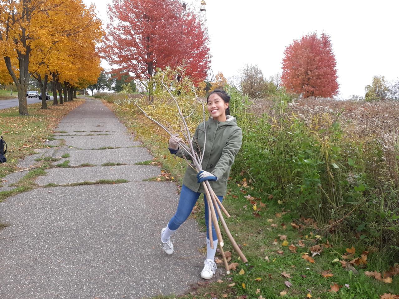 A student from Harding High Earth Club at the prairie at Mounds Park