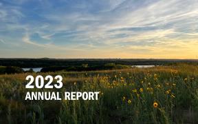 2023 Annual Report - Grey Cloud Dunes sunset over the river