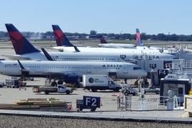 Delta planes lined up at various gates at MSP Airport.