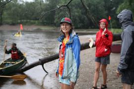 Michele Bevis ready to help a paddler come in off the river at an FMR event. 