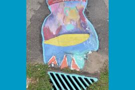 Colorful storm drain mural with text: Just water — no waste 
