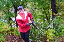 A volunteer hauls buckthorn in the river gorge