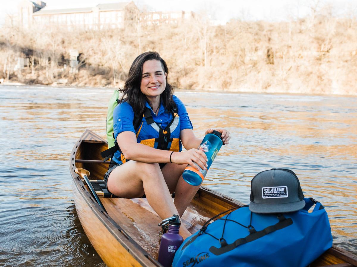 Natalie Warren in a canoe on the Mississippi River